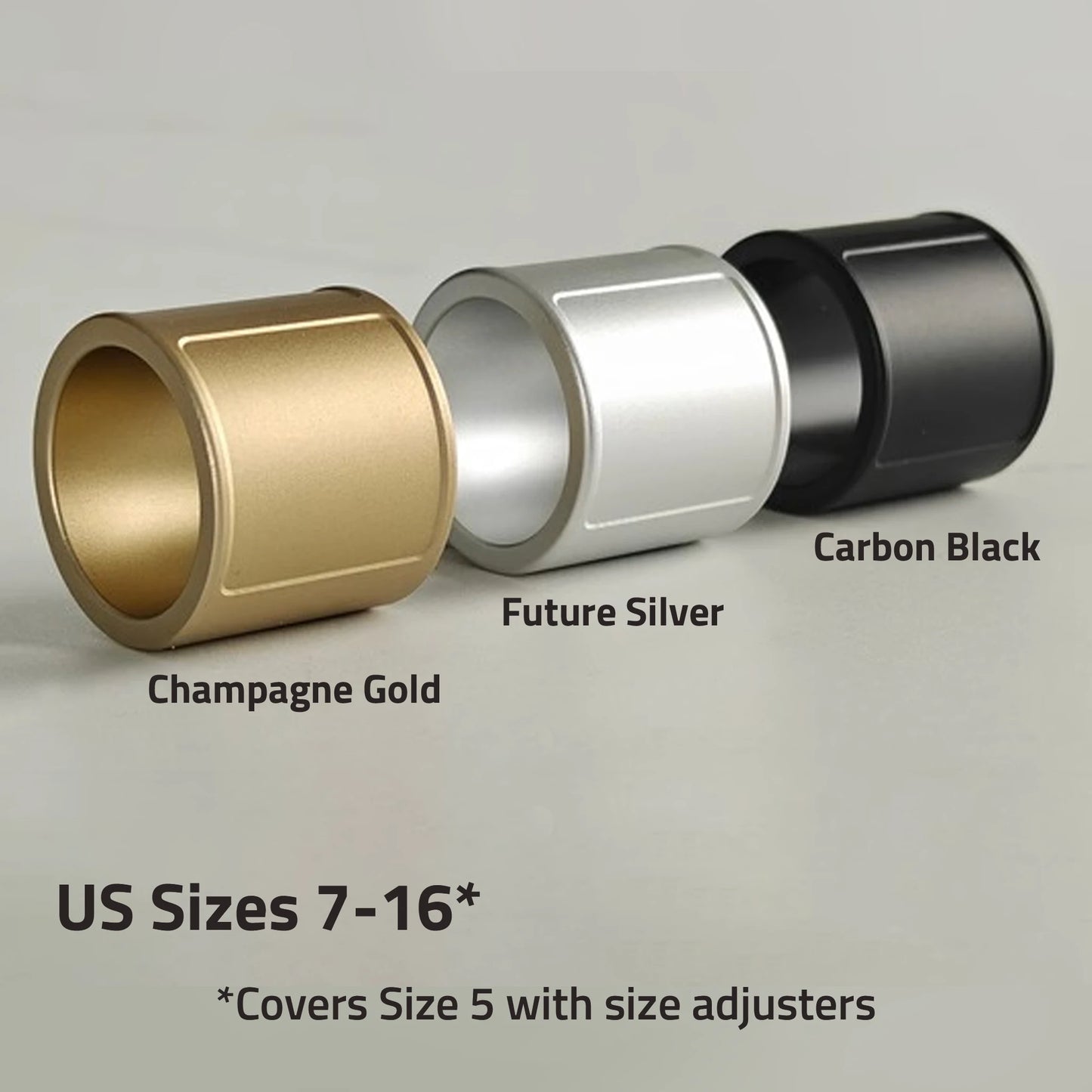 Three cylindrical metal components in Champagne Gold, Future Silver, and Carbon Black on a gray background.